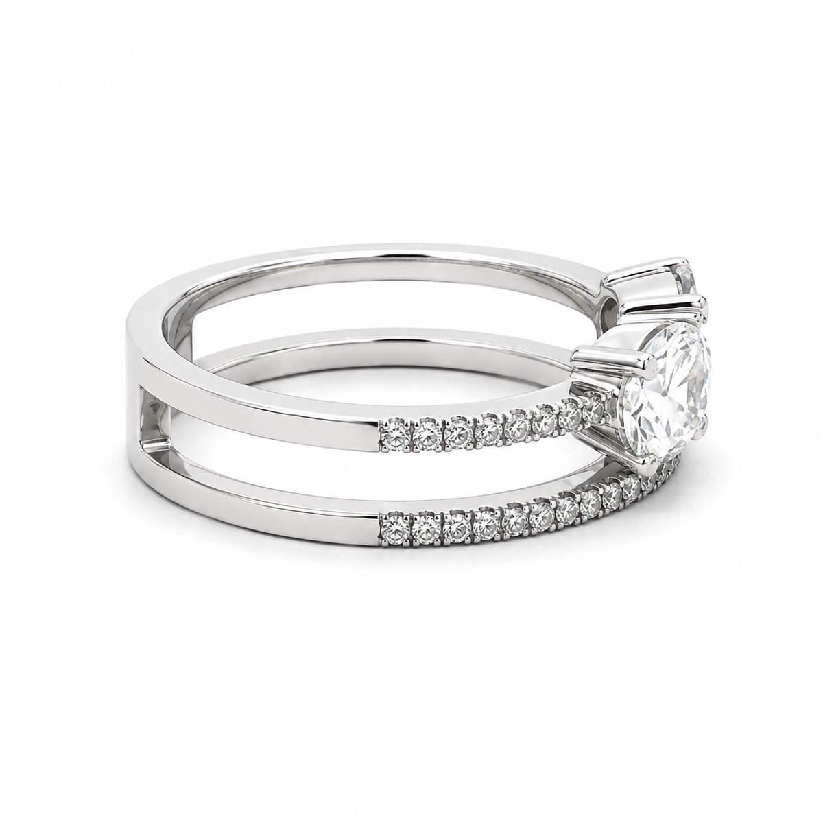 A silver-toned double-band ring featuring a large round-cut center stone and rows of small pavé-set diamonds along the band, shown on a clean white background.