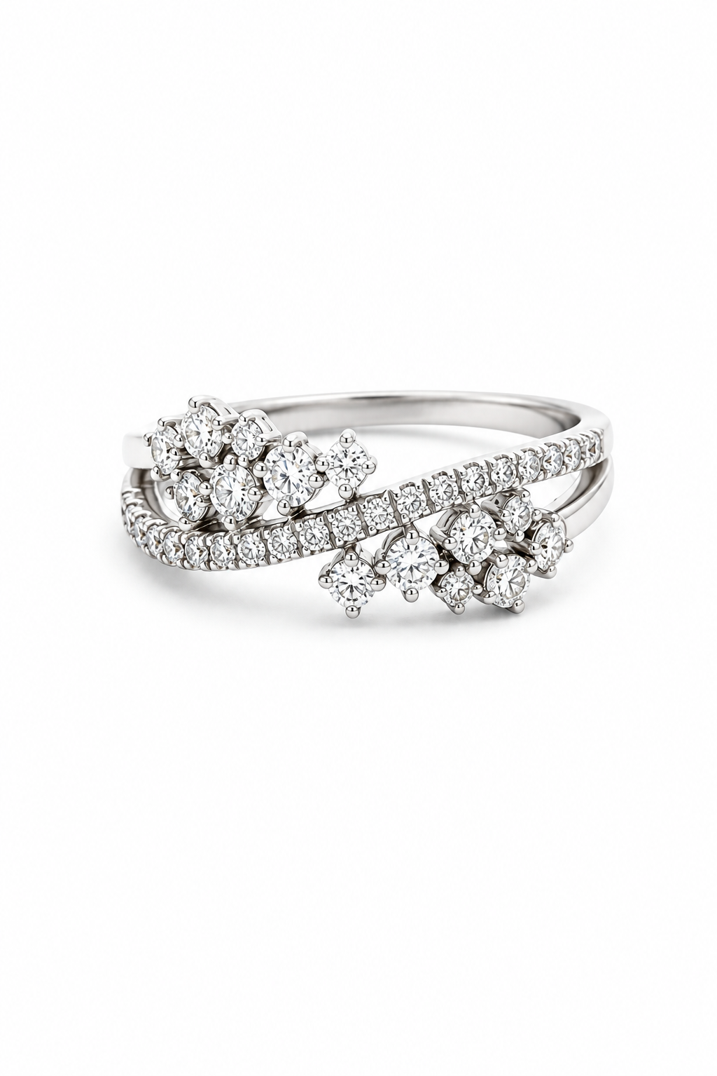 A silver-toned diamond ring with a split design featuring two floral clusters of round and pear-cut diamonds on a clean white background.