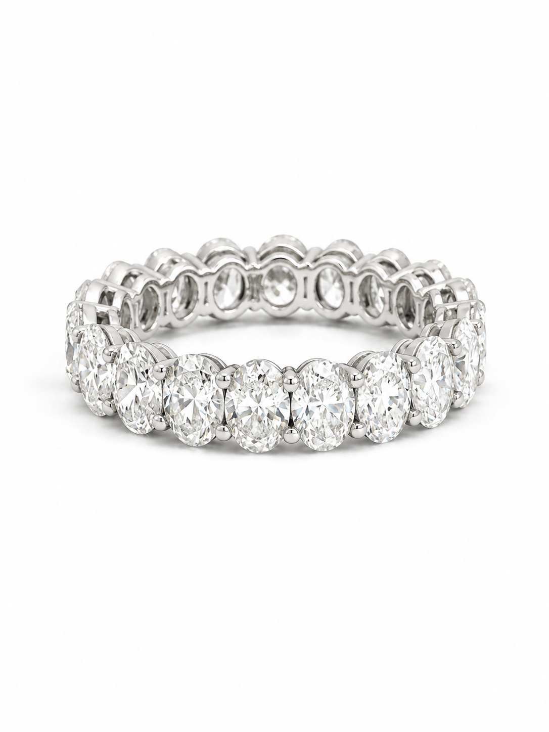 A silver-toned eternity ring featuring a continuous row of round brilliant-cut diamonds set in a polished band, shown against a plain white background.