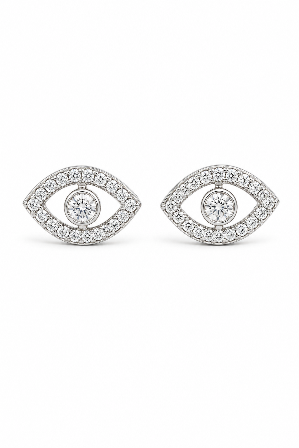 A pair of silver-toned eye-shaped stud earrings paved with small clear stones, featuring a central round clear stone, shown on a plain white background.